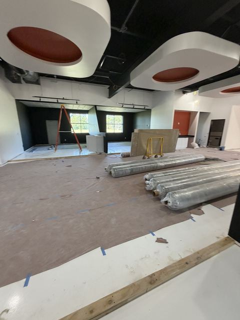 Commercial build-out with floor protection and materials before construction cleanup