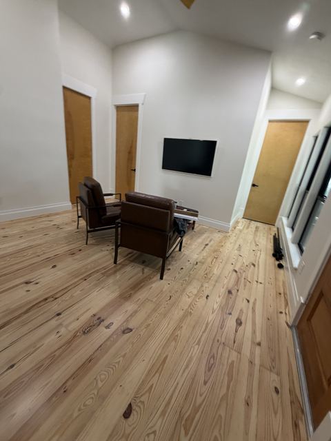 Finished room with clean pine floors after a final construction clean