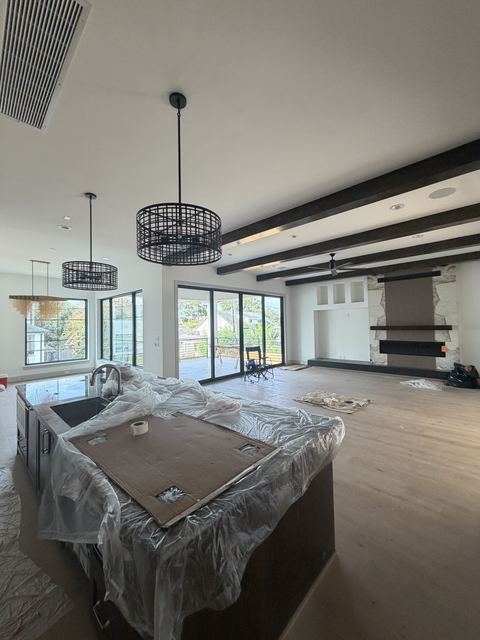 Open-concept new construction home in Houston with protected kitchen island before the final clean